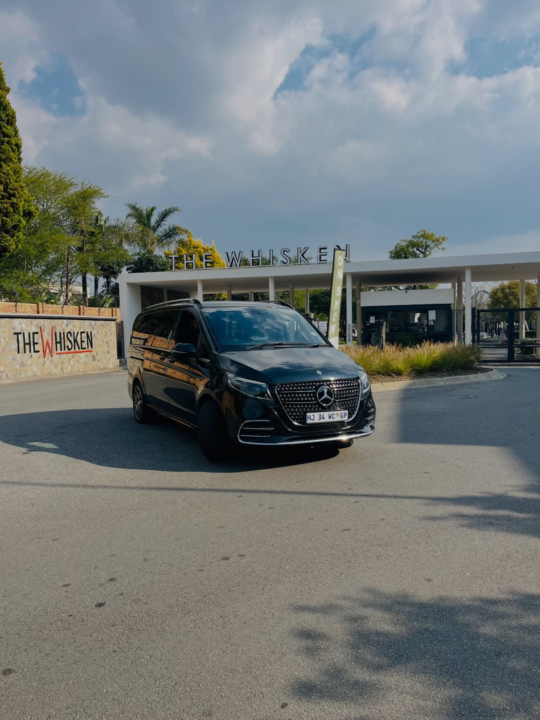 Black Mercedes V-Class shuttle outside The Whisken venue